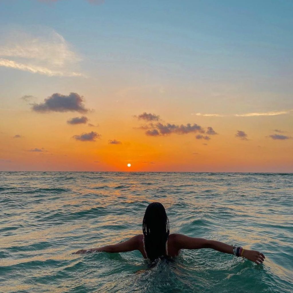 Guest swimming in the sea at sunset in Zakynthos
